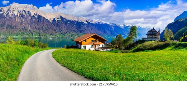 Idyllic Swiss nature landscape - green meadows surrounded by Alps mountains. Scenic lake Brienz, Iseltwald village - Shutterstock ID 2175959415