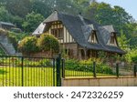 Idyllic traditional house seen in the Seine-Maritime department in the Normandy region in northern France at summer time