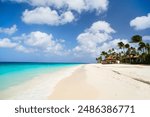 Idyllic tropical beach with white sand and turquoise ocean water on Aruba island in Caribbean