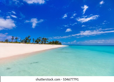 Idyllic tropical beach with white sand, turquoise ocean water and blue sky in Mozambique Africa
