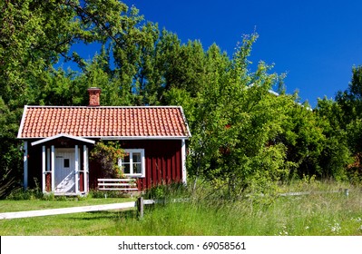 Idyllic, Typical Swedish Cottage In Summer Time.