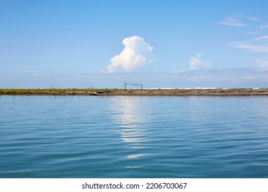 Idyllic View Of Blue Cloudy Sky Reflected On The Water