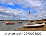 Idyllic view of boats in Burnham Overy Staithe, North Norfolk coast. Ample copy space. High quality photo