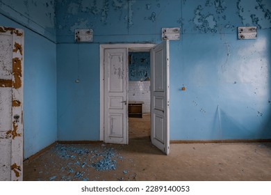 IDzyatlava, Belarus-January 2023: Interior of an abandoned empty room in an old dilapidated building with wooden ceilings ruined by dampness and lack of maintenance - Powered by Shutterstock