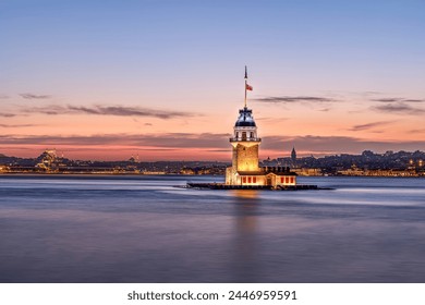 iery sunset over Bosphorus with famous Maiden's Tower (Kiz Kulesi) also known as Leander's Tower, symbol of Istanbul, Turkey. Scenic travel background for wallpaper or guide book - Powered by Shutterstock