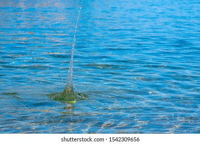 igh surge of water from falling into the sea a tennis ball - Powered by Shutterstock