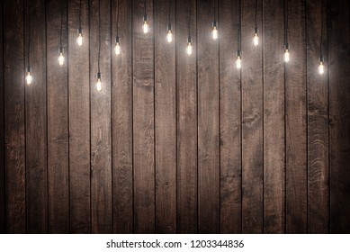 Light Bulbs On Dark Wooden Background Stock Photo (Edit Now) 340358495