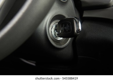 Ignition key of modern car close up. Car key in keyhole