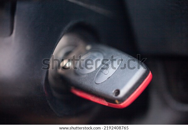Ignition\
key of modern car close up. Car key in\
keyhole.