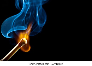 Ignition of match with smoke, isolated on black background