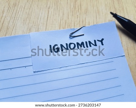 Ignominy writting on table background. 
