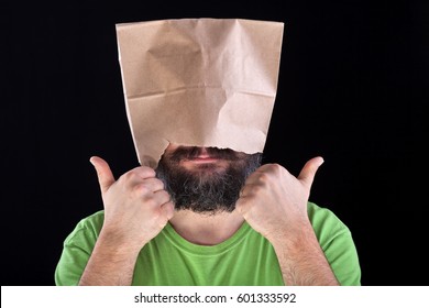 Ignorance is bliss - man likes his eyes and head being covered, taking the easy road concept - Shutterstock ID 601333592