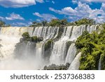 Iguazu falls, Cataratas del Iguazu waterfall in Brazil and Argentina. Huge powerful water stream in the tropical jungle forest of South America on river Iguasu