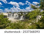 Iguazu falls, Cataratas del Iguazu waterfall in Brazil and Argentina. Huge powerful water stream in the tropical jungle forest of South America on river Iguasu