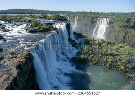 Iguazu Falls is a series of waterfalls on the border of Brazil and Argentina