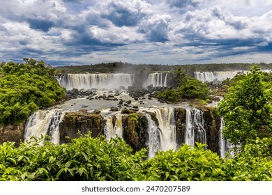 Iguazu falls waterfall in Argentina and Brazil border on the river Iguazu. Tropical landscape with powerful waterfall stream in the jungle. Iguassu falls, cataratas iguazu natural wonder national park - Powered by Shutterstock