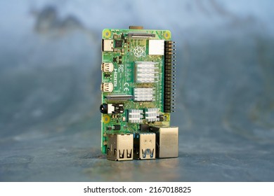 Ihringen, Baden Wuerttemberg, Germany - June 11, 2022: Raspberry Pi 4 B circuit board on a grey slate background.