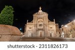 iIluminated facade of the Papal Basilica of Saint Mary of the Angels in Santa Maria degli Angeli, Assisi, region of Umbria, Italy