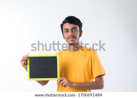 iIndian young Man showing blank signboard on background