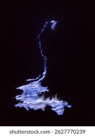 Ijen blue flame. Fire that come from the sulphur crater. Glowing in the dark.