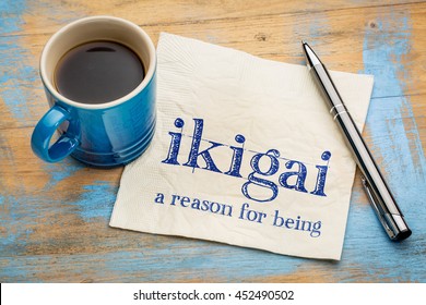ikigai - Japanese concept  - a reason for being or a reason to wake up - handwriting on a napkin with a cup of espresso coffee