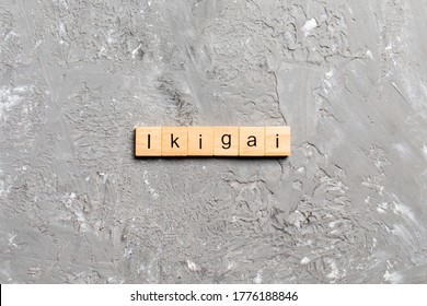 ikigai word written on wood block. ikigai text on table, concept.