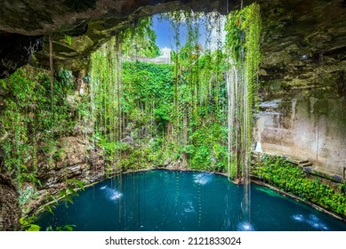 Ik-Kil Cenote, Mexico. Lovely cenote in Yucatan Peninsulla with transparent waters and hanging roots. Chichen Itza, Central America. - Shutterstock ID 2121833024