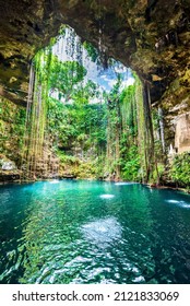 Ik-Kil Cenote, Mexico. Lovely cenote in Yucatan Peninsulla with transparent waters and hanging roots. Chichen Itza, Central America. - Shutterstock ID 2121833069