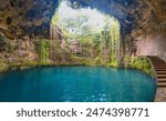 Ik-Kil Cenote near Chichen Itza, Mexico. Lovely cenote with transparent turquoise waters and hanging roots - Yucatan Peninsula, Mexico