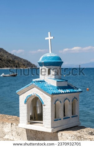 Ikonostasia chapel, miniture Greek chapel with blue sky