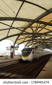 Ilan County , Taiwan : Jan 15th ,2018 : Taroko Express Train Is Coming Pass Dong Shan Train Station With The Shed For The Melon Style