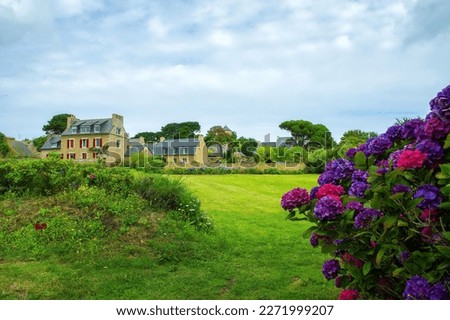 Ile de Brehat, France. Country House with Flower Garden at picturesque Ile de Brehat island in Cotes-d'Armor department of Brittany