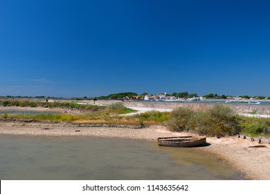 Ile De Ré Landscape With Village Loix And Salt Lake With Boat