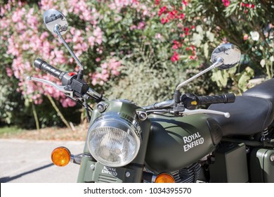 Ile de re, France - August 22, 2016 : Halft on Indian Royal Enfield 500 Classic in Military Green color parked at highway for view at Ile de re France, an island near La Rochelle.
