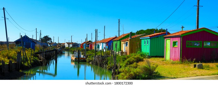Ile d'Oleron, river and colored oyster huts farmer- Charente Maritime France