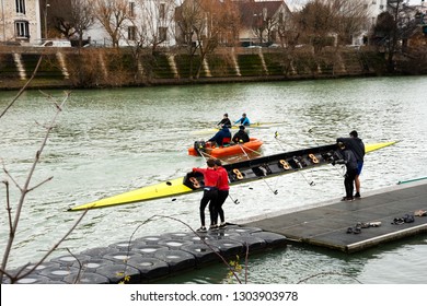 ILE-DE-FRANCE, FRANCE - JANUARY 26, 2019: Junior Rowers Training At Marne River. Boys Carrying And Getting The Boat In The Water.