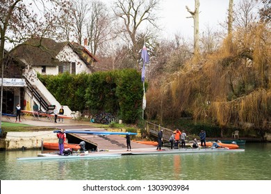 ILE-DE-FRANCE, FRANCE - JANUARY 26, 2019: Junior Rowers Training At Marne River. Boys Carrying And Getting The Boat In The Water.