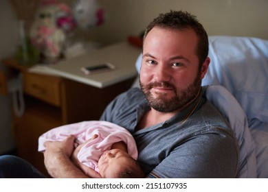 Ill Be The Best Dad In The World For Her. Portrait Of A Happy Father Holding His Newborn Baby Girl In The Hospital.