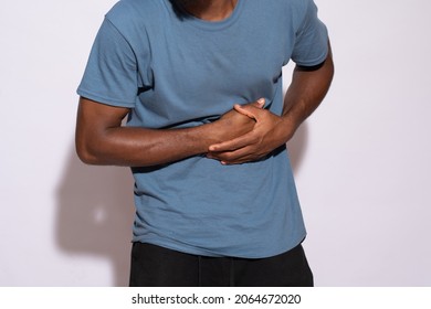 Ill Black Man Holding His Stomach In Discomfort