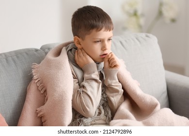 Ill little boy with sore throat at home