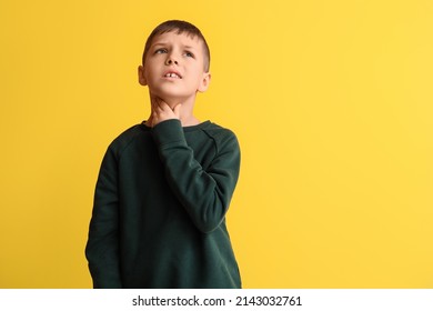 Ill Little Boy With Sore Throat On Color Background