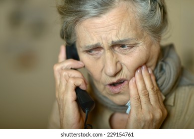 Ill Senior Woman Having Tooth Pain. Isolated On Blue