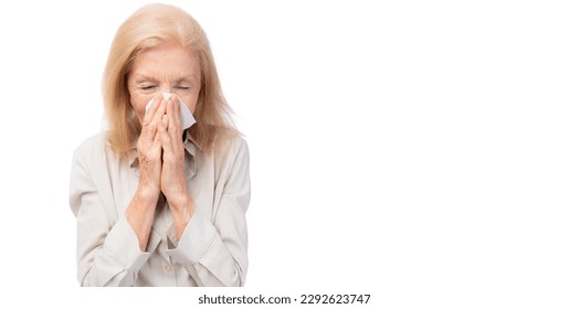 Ill woman runny nose sneezes into tissue Flu allergy Sick old lady sneezing in tissue Senior illness human got sick and flu on white background It allergy season Shot of elderly woman with flu allergy - Powered by Shutterstock