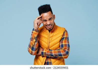 Ill Young Black Man 20s Years Old Wears Yellow Waistcoat Shirt Put Hands On Temple Having Headache Suffering From Migraine Feel Bad Seedy Isolated On Plain Pastel Light Blue Background Studio Portrait