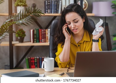 Ill Young Woman With Cold Talking On Mobile Phone With Tissue For Flu Virus.