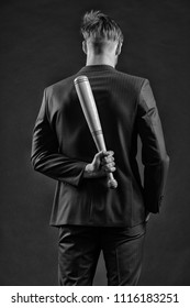 Illegal Business. Businessman With Baseball Bat, Back View. Man In Formal Wear Hide Wooden Bat. Persecution. Raider Seizure. He Can Stop Any Crime. Aggression And Violence, Black And White.