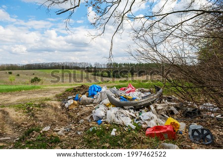 Illegal garbage dump near the forest.