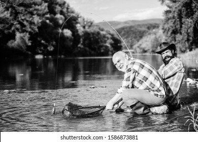 Illegal Hunting Caviar. Extracts Eggs From Sturgeon Caught River. Trap For Fish. Men Sit At Riverside With Fishing Equipment. Poaching Crime And Fishing License. Poachers Fishing. Black Market Caviar.