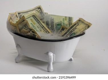 Illegal Money Washing In Claw Foot Bath Tub Full Of Soapy Water. 