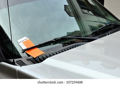 Illegal Parking Violation Citation On Car Windshield
